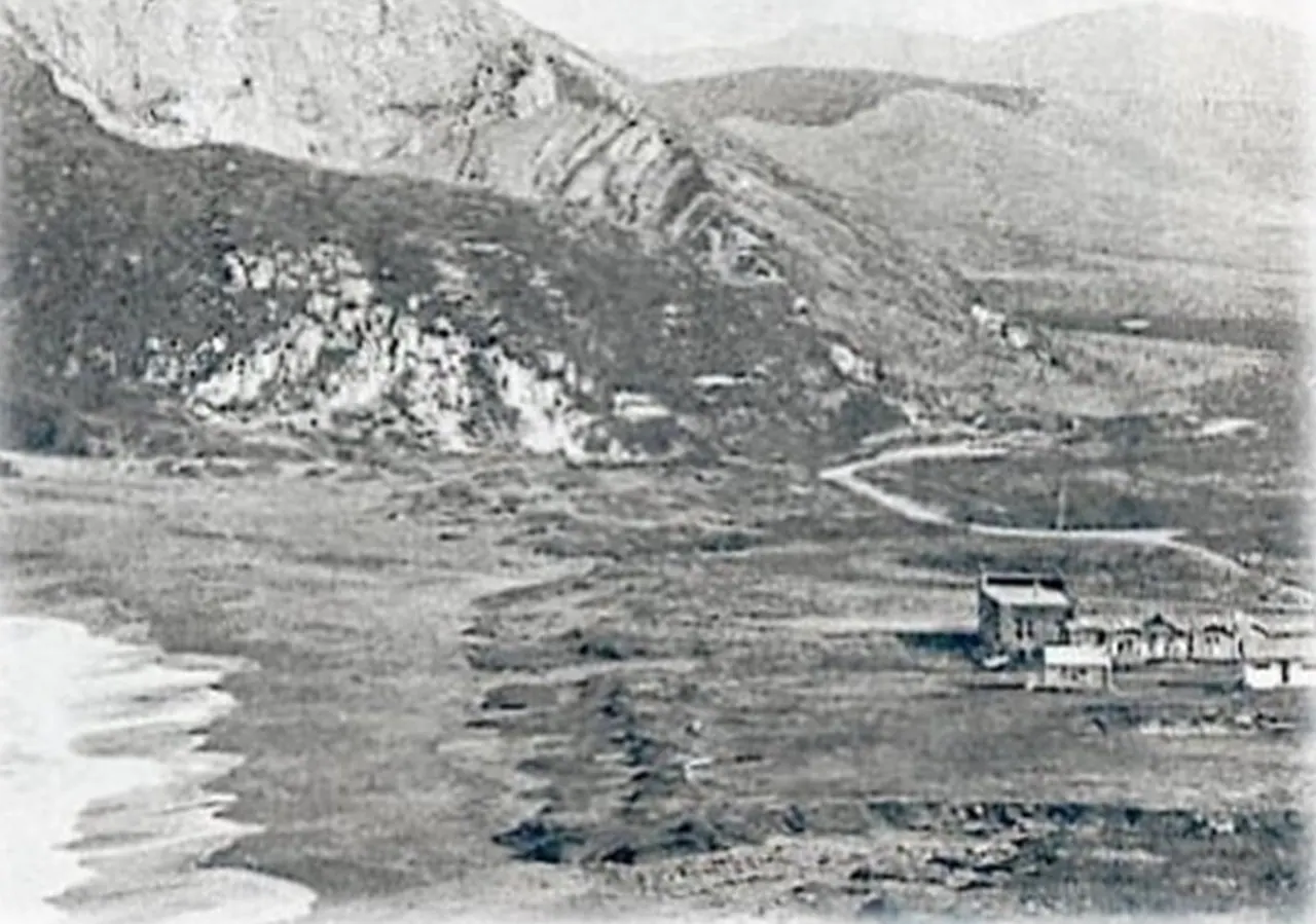Historic photograph of Rockaway Quarry in Pacifica, California, showing the coastal cliffs, quarry hillside, and early seaside buildings before modern development.