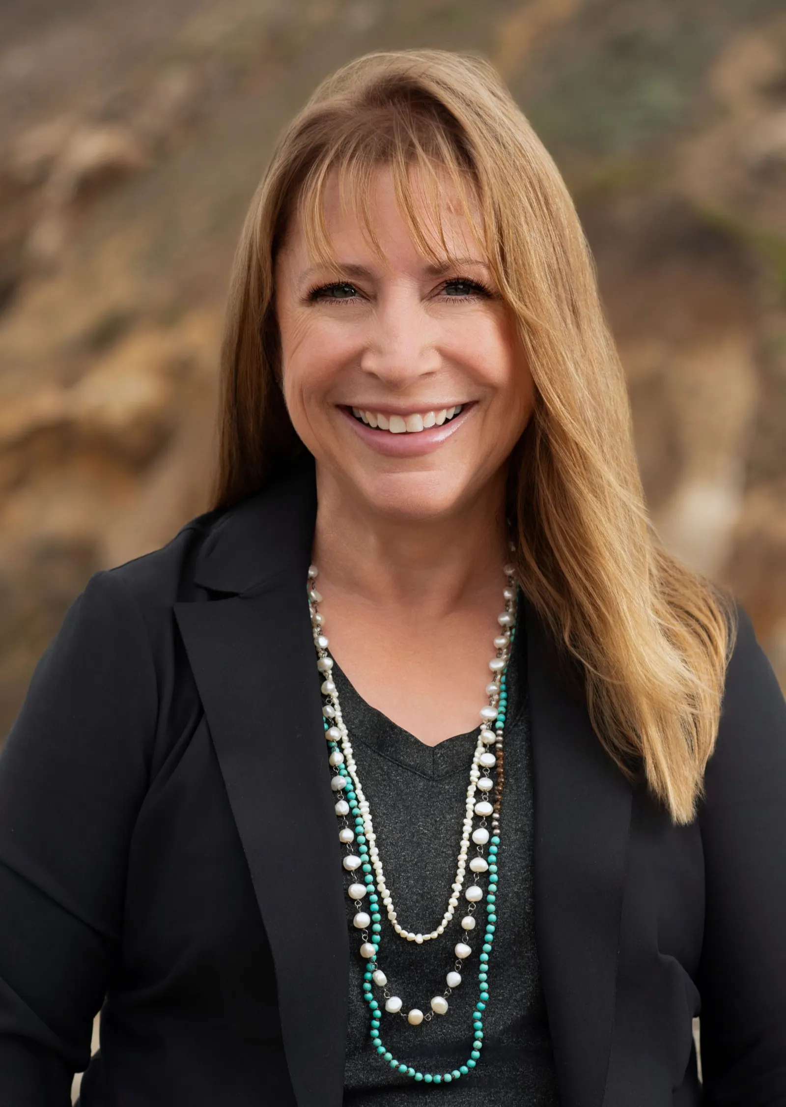 Professional headshot of Vicki Moore, a friendly and experienced Realtor® based in Pacifica, California with eXp Realty.