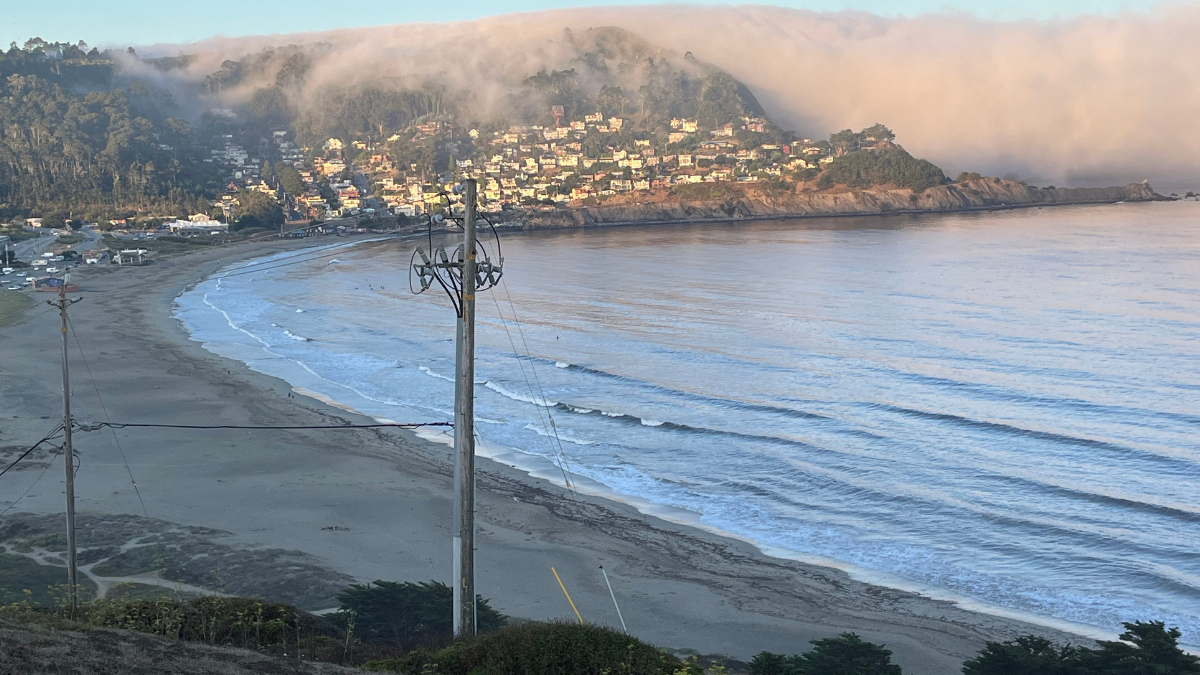 Linda Mar State Beach with the fog coming over the Pedro Point headlands