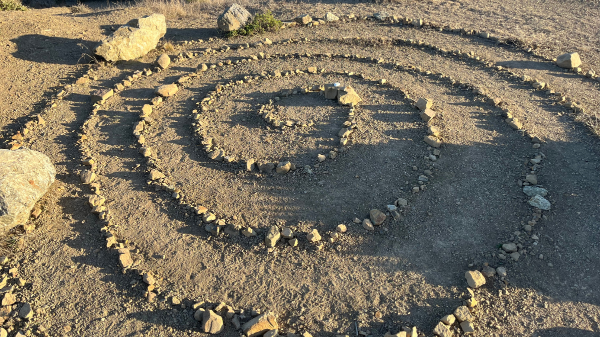 Stone spiral labyrinth at Pedro Point Headlands in Pacifica, California coastal landscape